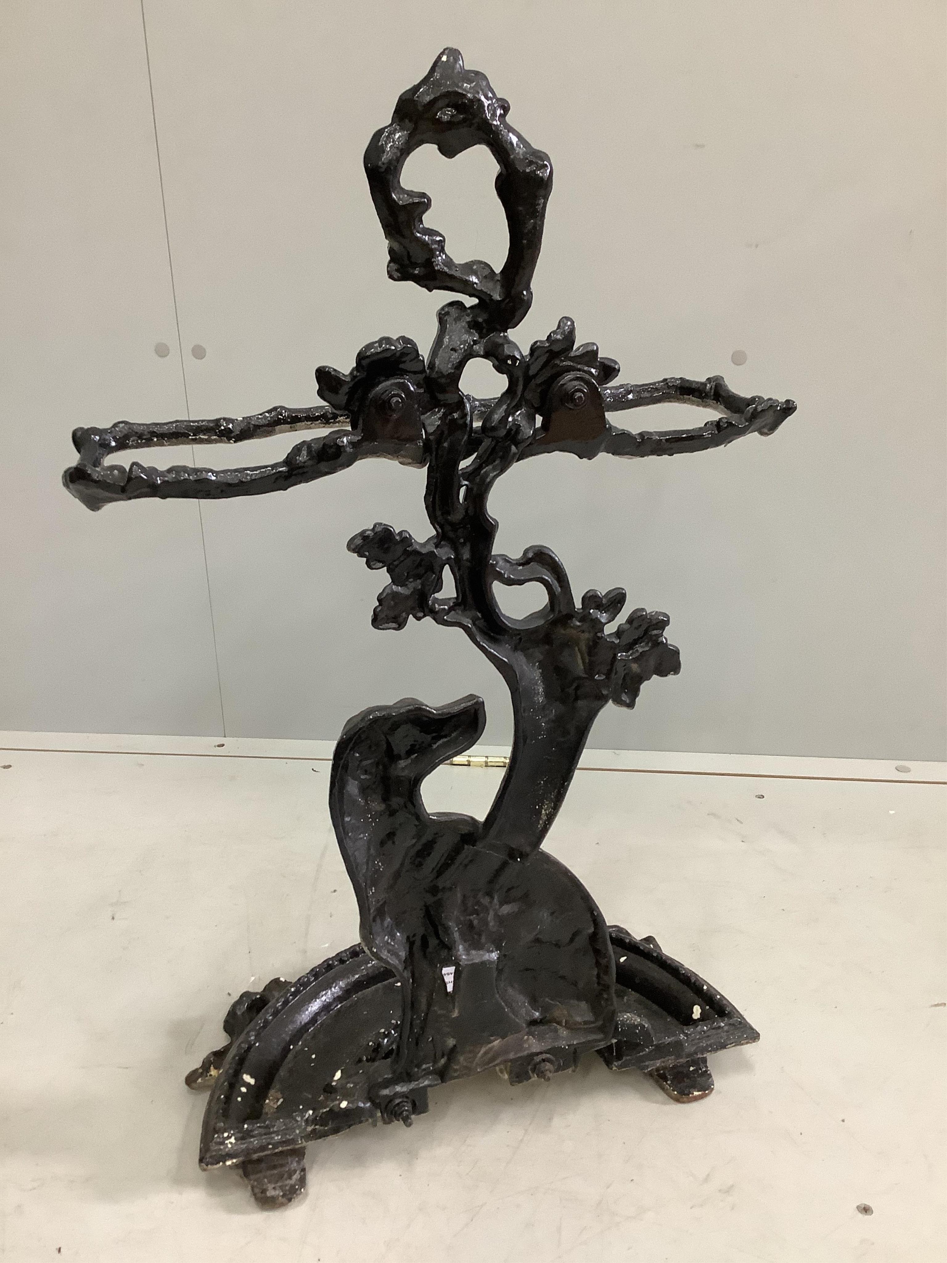 A Victorian cast iron stick stand, width 42cm, height 72cm. Condition - fair